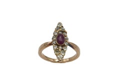 An old ring with a pink ruby and diamonds from the late 19th century.