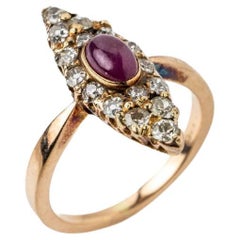 An old ring with a pink ruby and diamonds from the late 19th century.