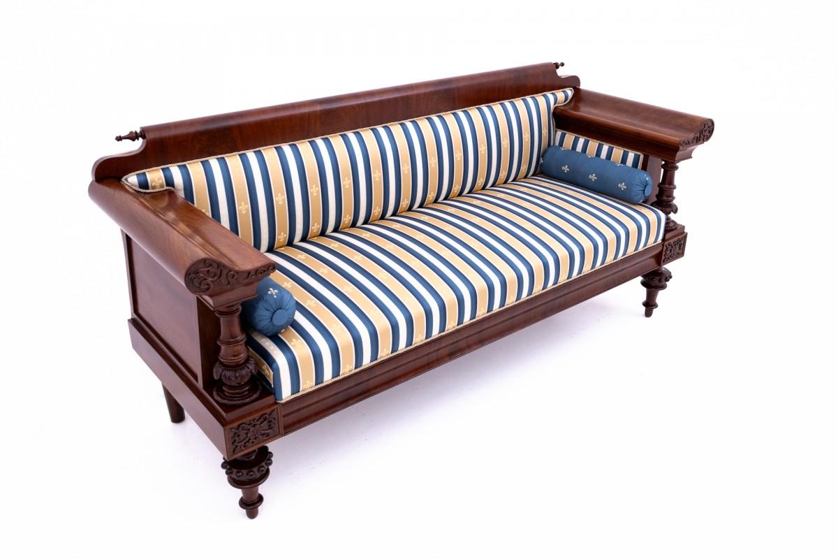 An old sofa in an eclectic style. The furniture is in very good condition, after professional renovation. The sofa has been covered with new fabric.

Origin: Western Europe, 19th century.

Dimensions:

height 90cm

width 197cm

seat height