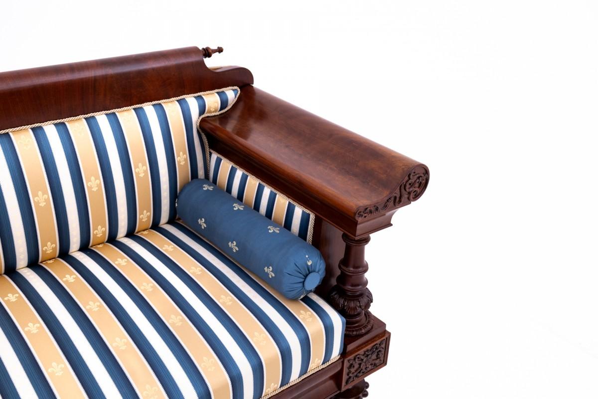French An old sofa in an eclectic style, Western Europe. After renovation.