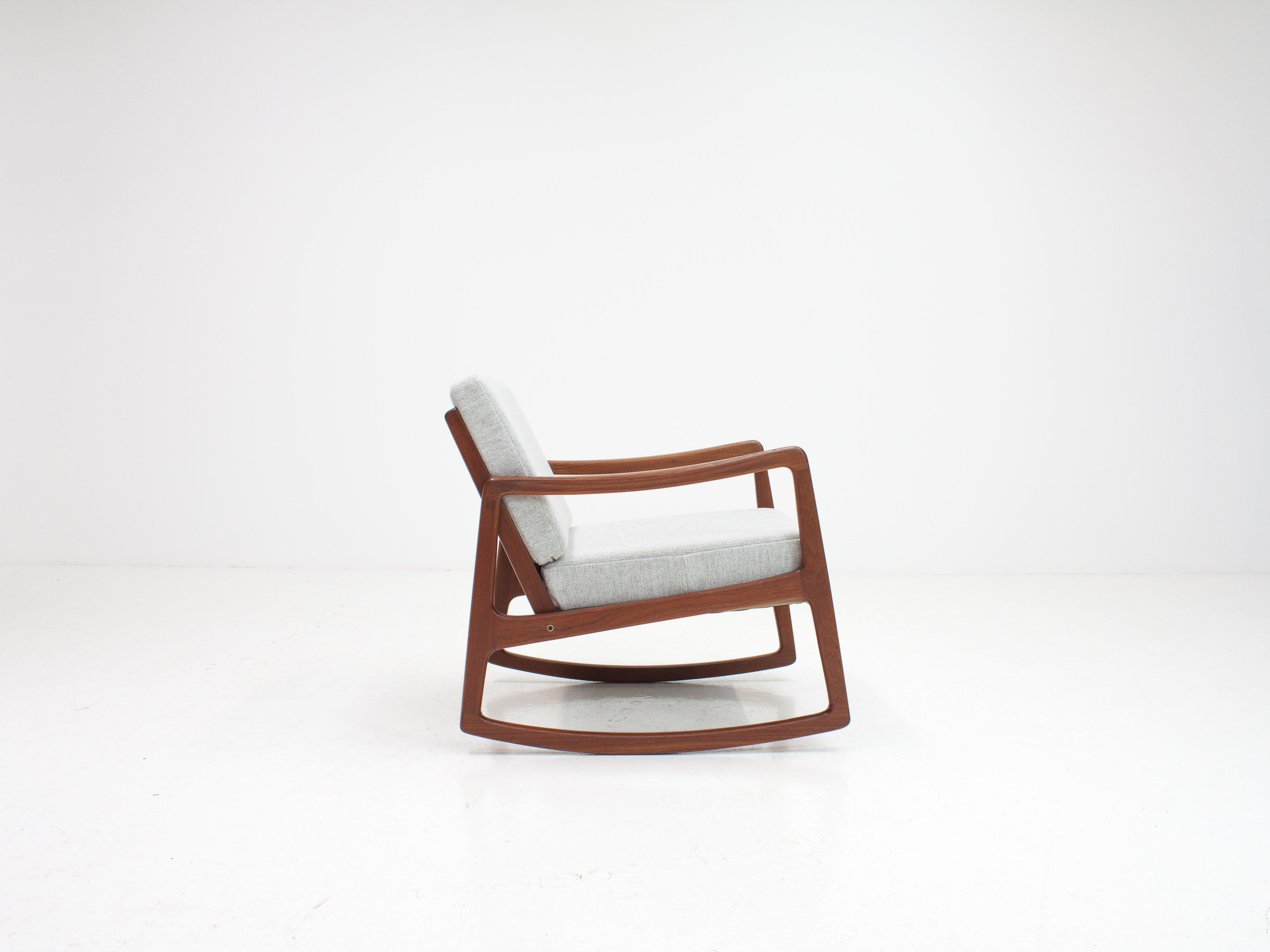 An Ole Wanscher model 120 teak rocking chair for France & Son.

The receiver of a 'Good Design' award from MoMA New York. 

A rare Ole Wanscher design dating from 1952 with an amazing Minimalist look, featuring a low back which gives the piece a