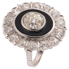 An Onyx And Diamond Cluster Ring 