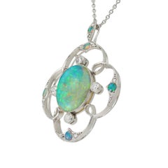 An opal and diamond Art Deco pendant