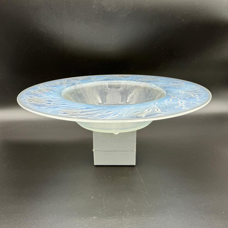 The Anvers plate belongs to the designs Suzanne lalique has produced for her father R.Lalique .

The Anvers plate has been decorated with swimming fishes around a see weed center .

The bowl is in opalescent glass and  hand signed in wheel cut block