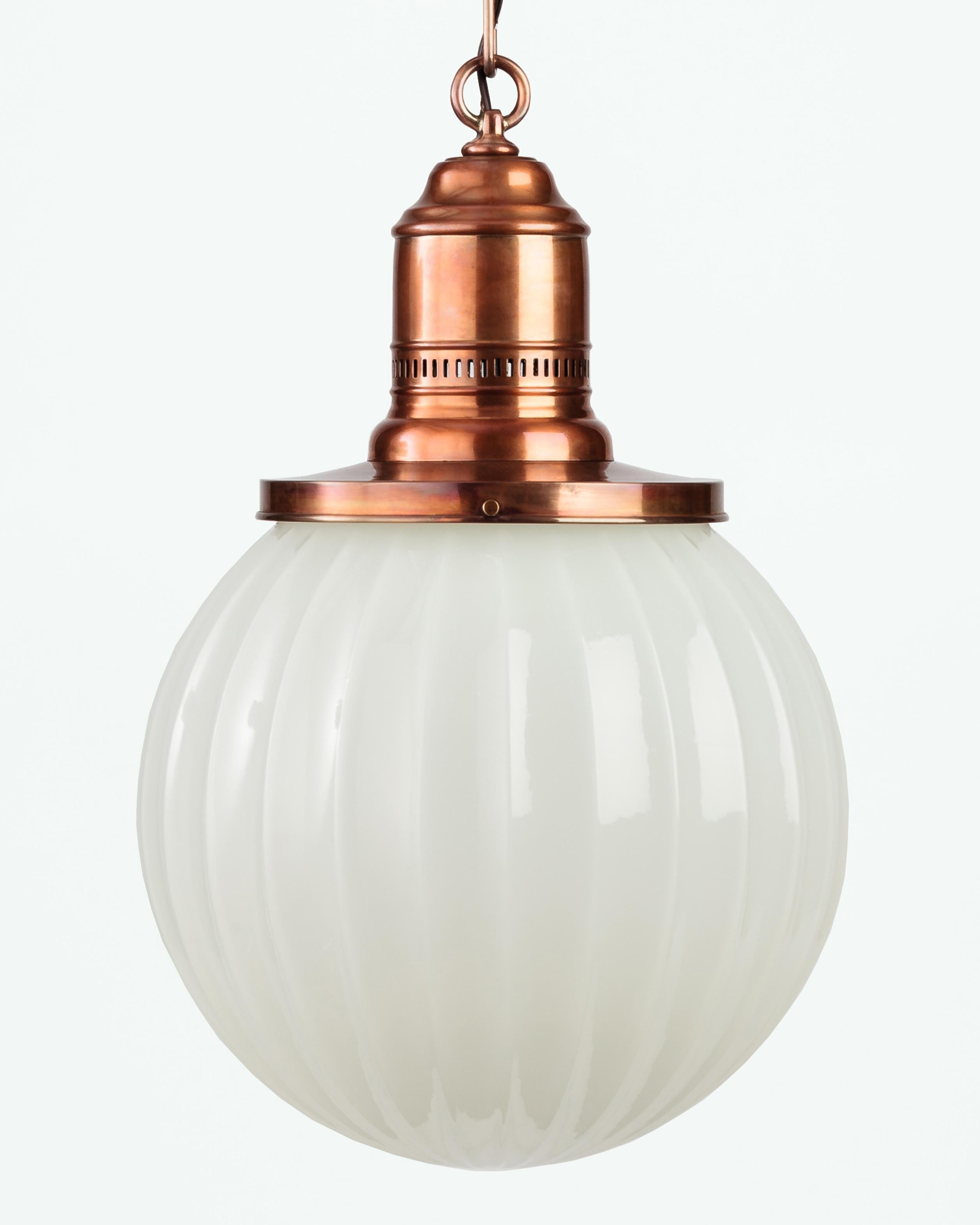AHL3768

An antique fluted opaline glass globe on warm aged copper fittings, the vintage fitter with pierced details. Due to the antique nature of this fixture, there may be some nicks or imperfections in the glass as well as variations from piece