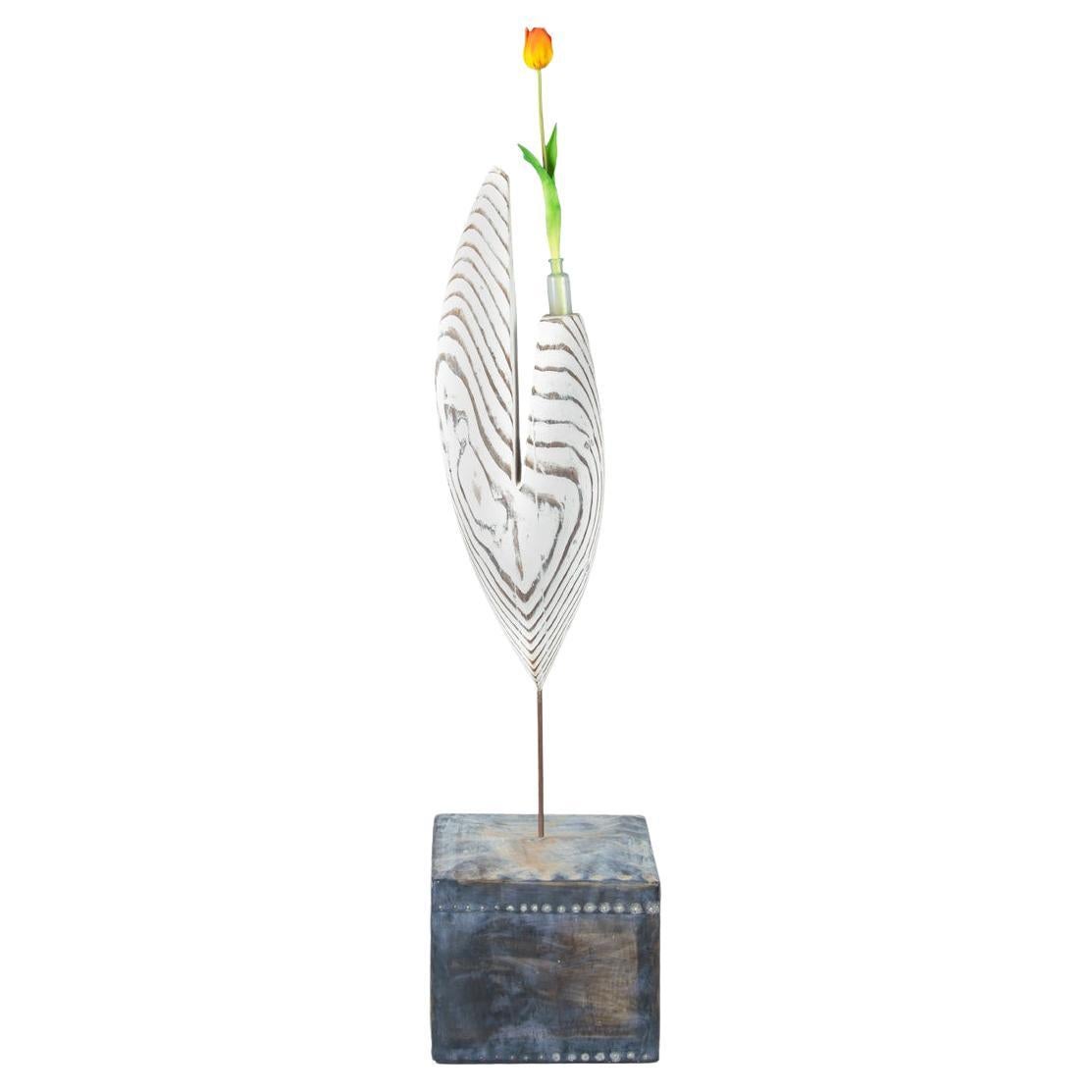 An openwork oval driftwood sculpture/flower holder by Martin Scorey