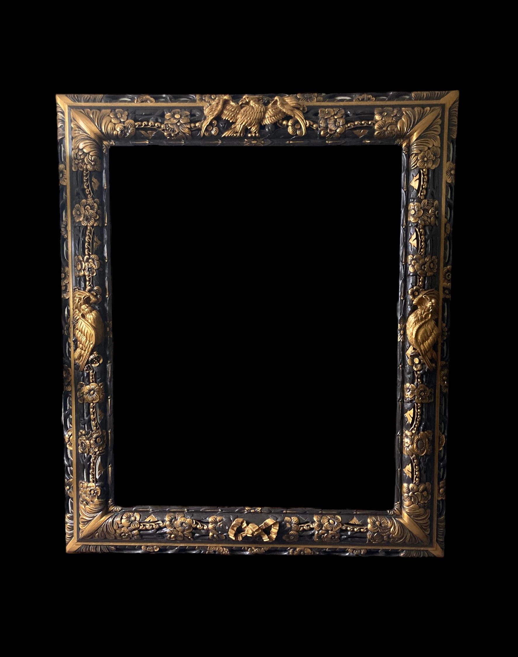 An opulent carved and painted continental wall mirror of large proportions, circa 1890, the mercury plate is surrounded by a deep two tier frame depicting hand painted gilt coloured eagles, fruit, flowers and ribbons accentuated by a rich deep