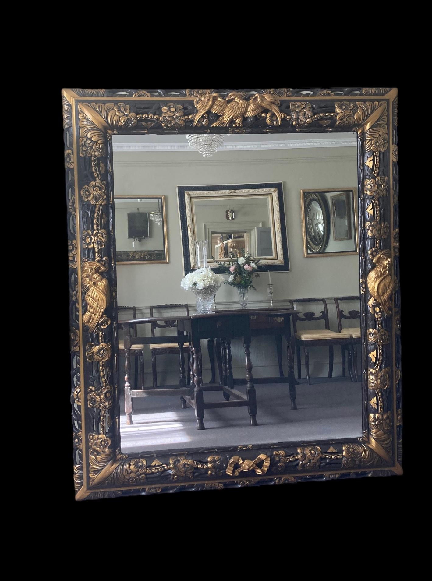 Mahogany An Opulent carved and painted late 19th C wall mirror of large proportions For Sale