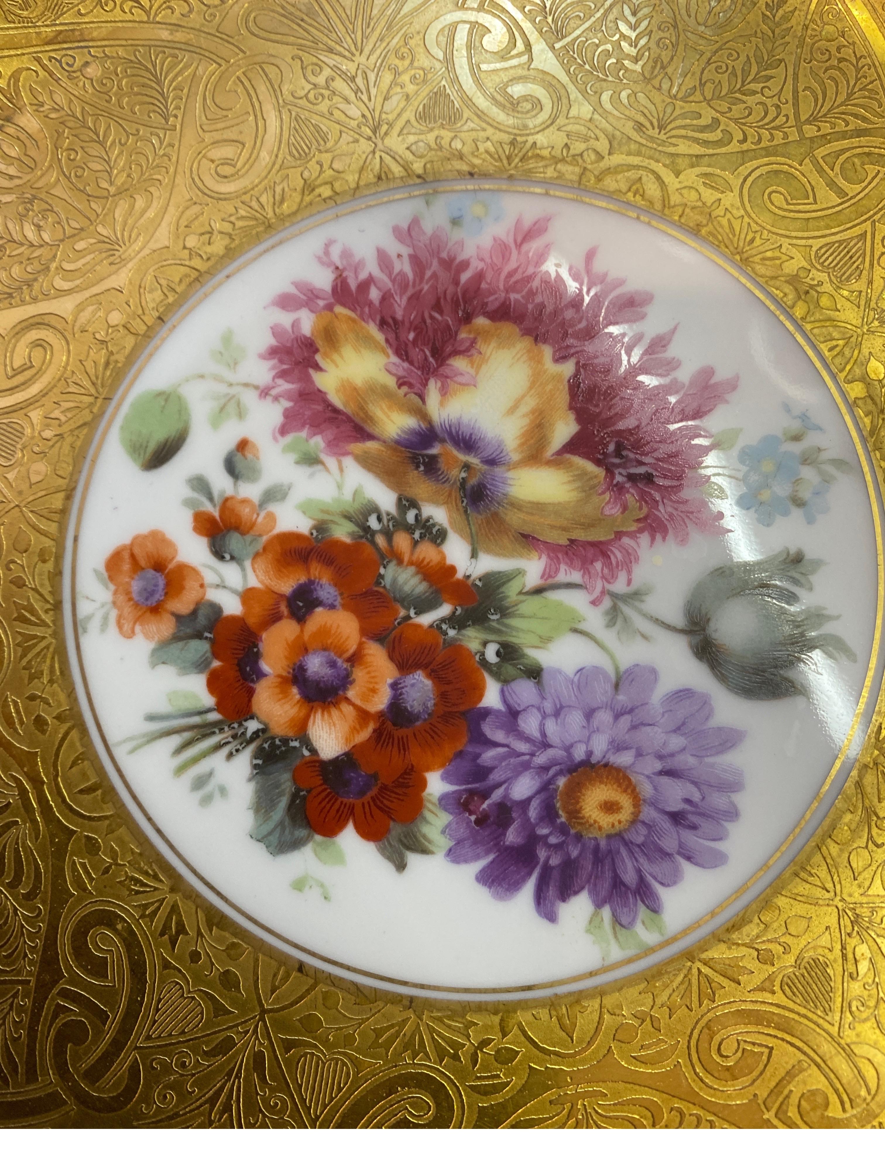 German An opulent set of 12 gold encrusted floral service plates For Sale
