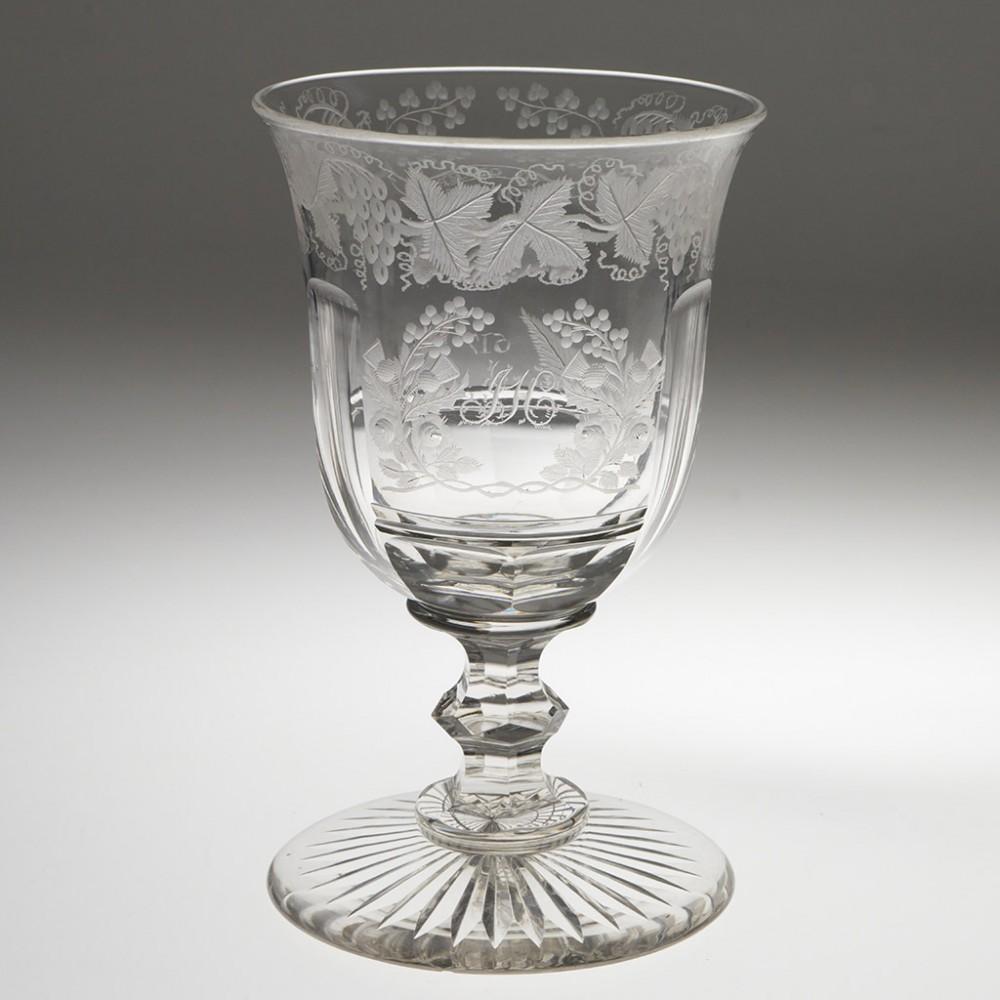 Heading : An Orange Order Engraved Glass Goblet
Period : Victoria
Origin : England or Ireland
Colour : Clear
Bowl : Lipped round funnel. Engarved with a band of fruiting vines above a cartouche or thistles and roses ( note the absence of shamrocks)