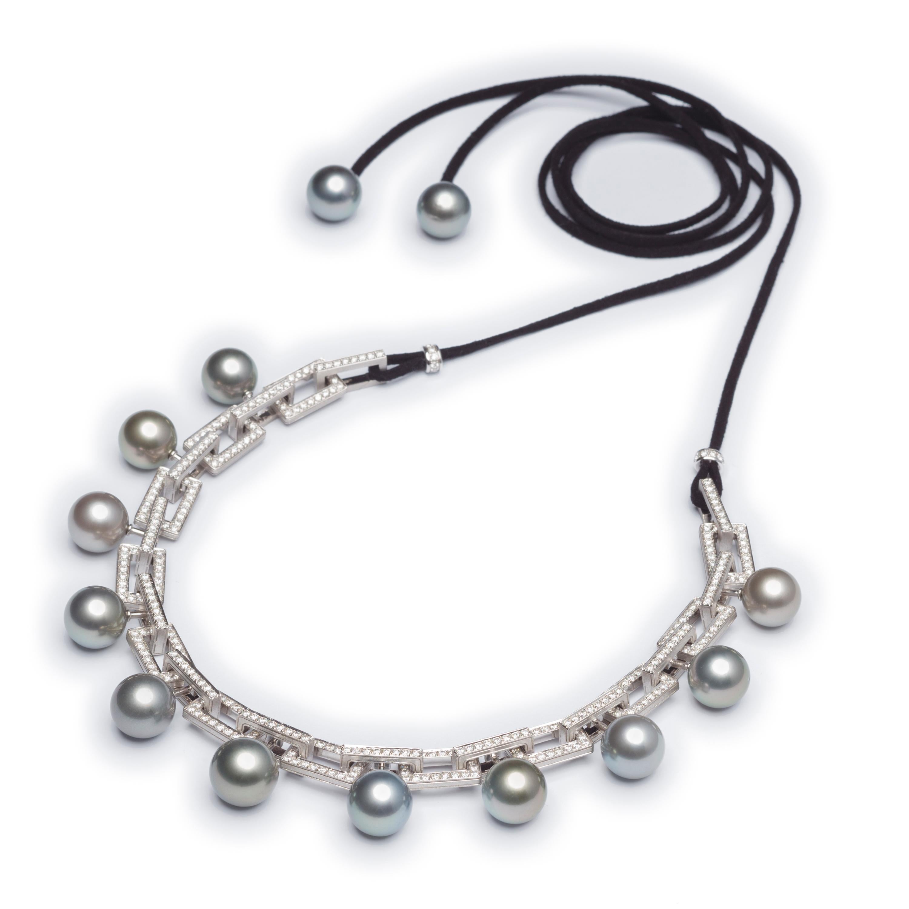 Collection:  Ode to Mother Oyster

Title: Rock & Roll Pearls

Juxtaposition has a wonderful way of allowing each to shine in equal parts and that is exactly what our Rock & Roll Pearl Choker & Bracelet has achieved.  With Solid diamond studded chain