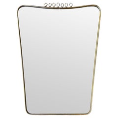 An original 1950s Italian brass framed mirror attributed to Gio Ponti
