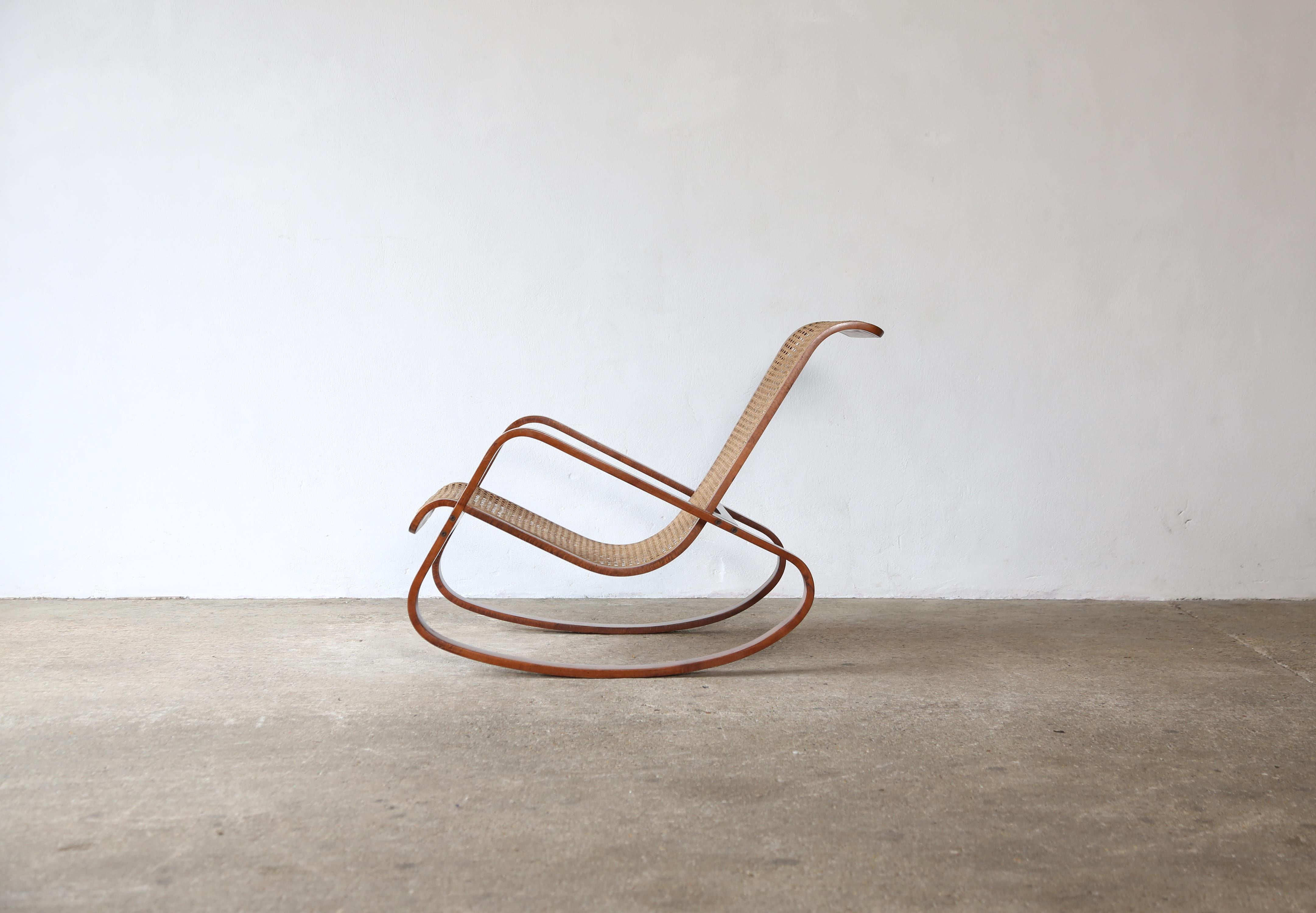 An original Dondolo rocking chair by Luigi Crassevig, Italy, 1970s.  Bentwood and original cane.   We only have a single chair available.   The price is for the single chair.   Fast shipping worldwide.

