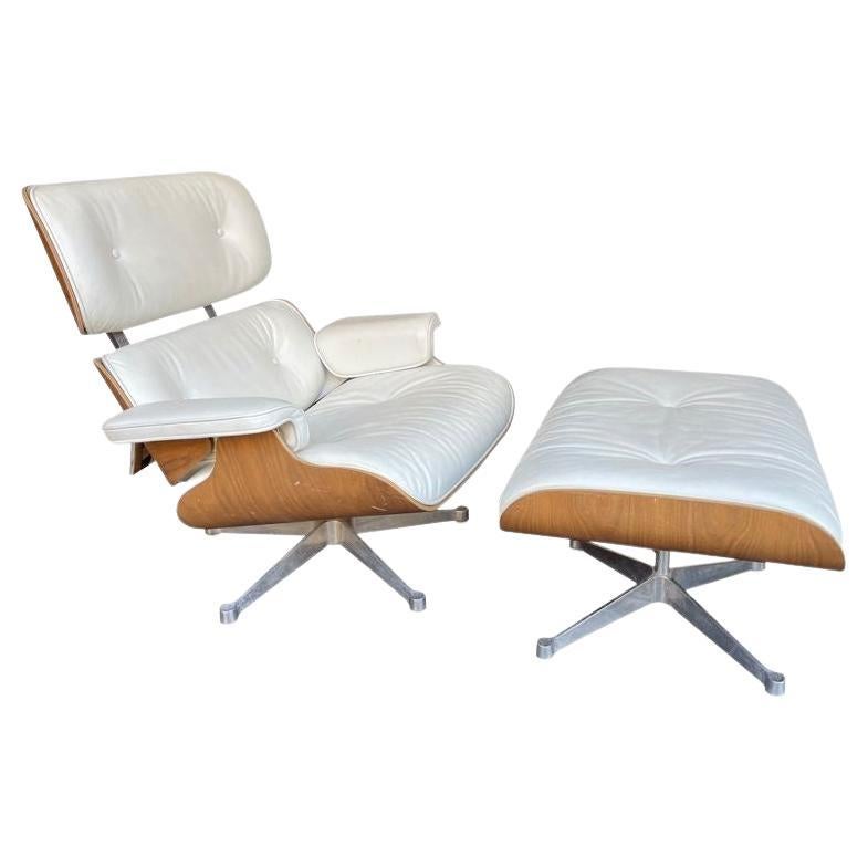 Original Eames Lounger and Ottoman by Vitra in "Snow" Leather and Cherry Base