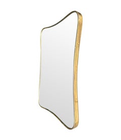 An original Italian 1950s brass framed mirror with shaped curved corners.