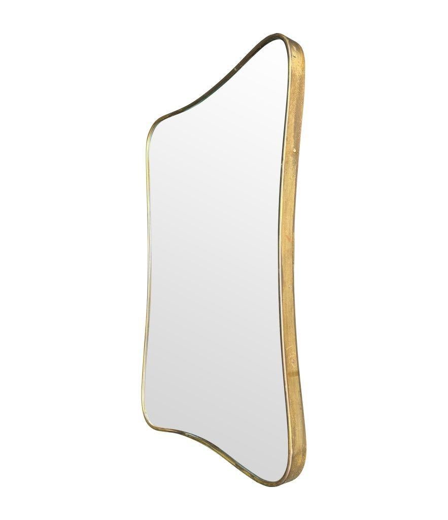 An original Italian 1950s brass framed mirror with shaped curved corners. For Sale 1