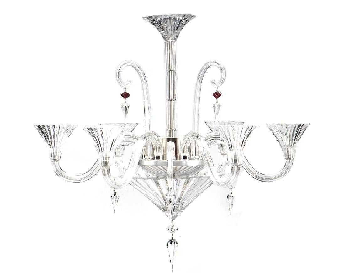 A modern clear crystal six-light hanging chandelier with six additional scroll arms with hanging faceted crystals by Baccarat.
Measures: 33