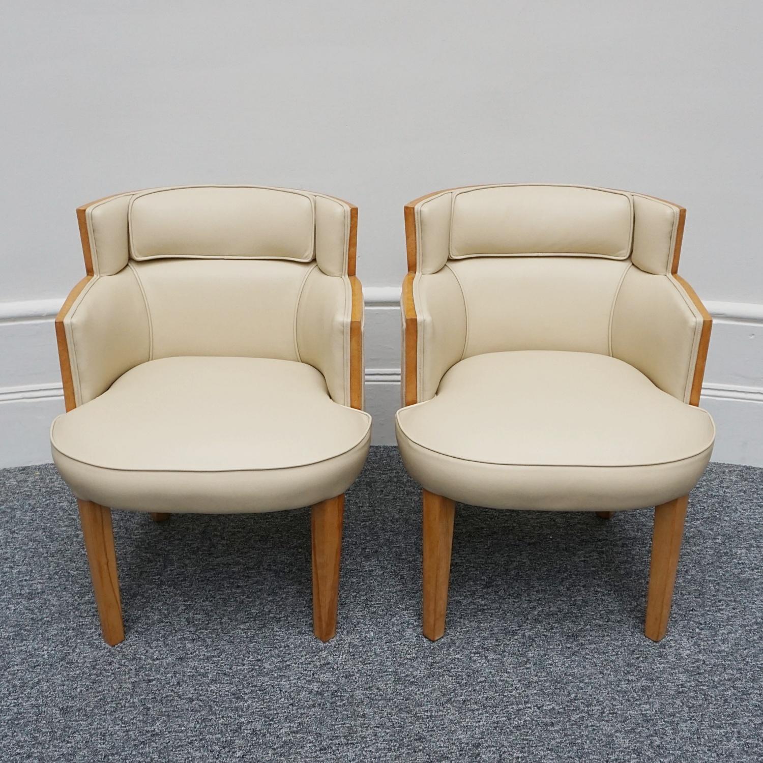 An Art Deco pair of Bankers chairs. Birdseye maple veneered with solid satin birch legs. Re-upholstered in cream leather and contrasting oatmeal faux suede. 

Dimensions: H 78cm W 59cm D 53cm Seat H 47cm W 45cm D 48cm 

Origin: English

Date: Circa