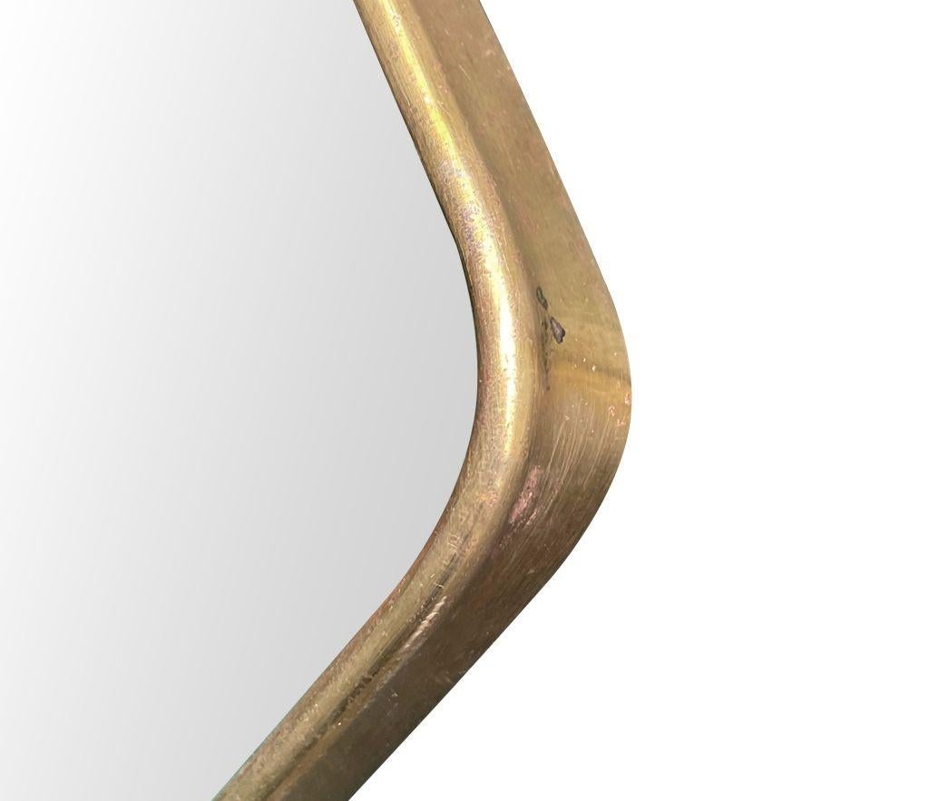 The original Italian 1950s brass shield mirror in the style of Gio Ponti en vente 1
