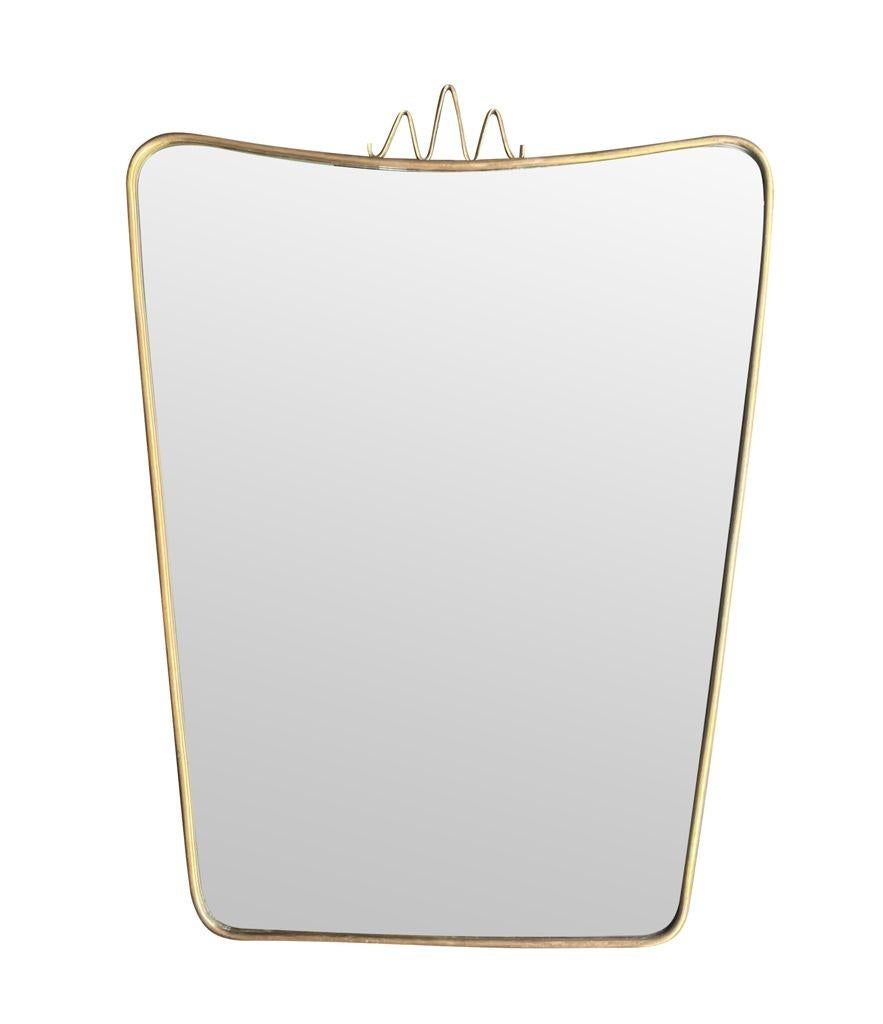 The original Italian 1950s brass shield mirror in the style of Gio Ponti en vente 3