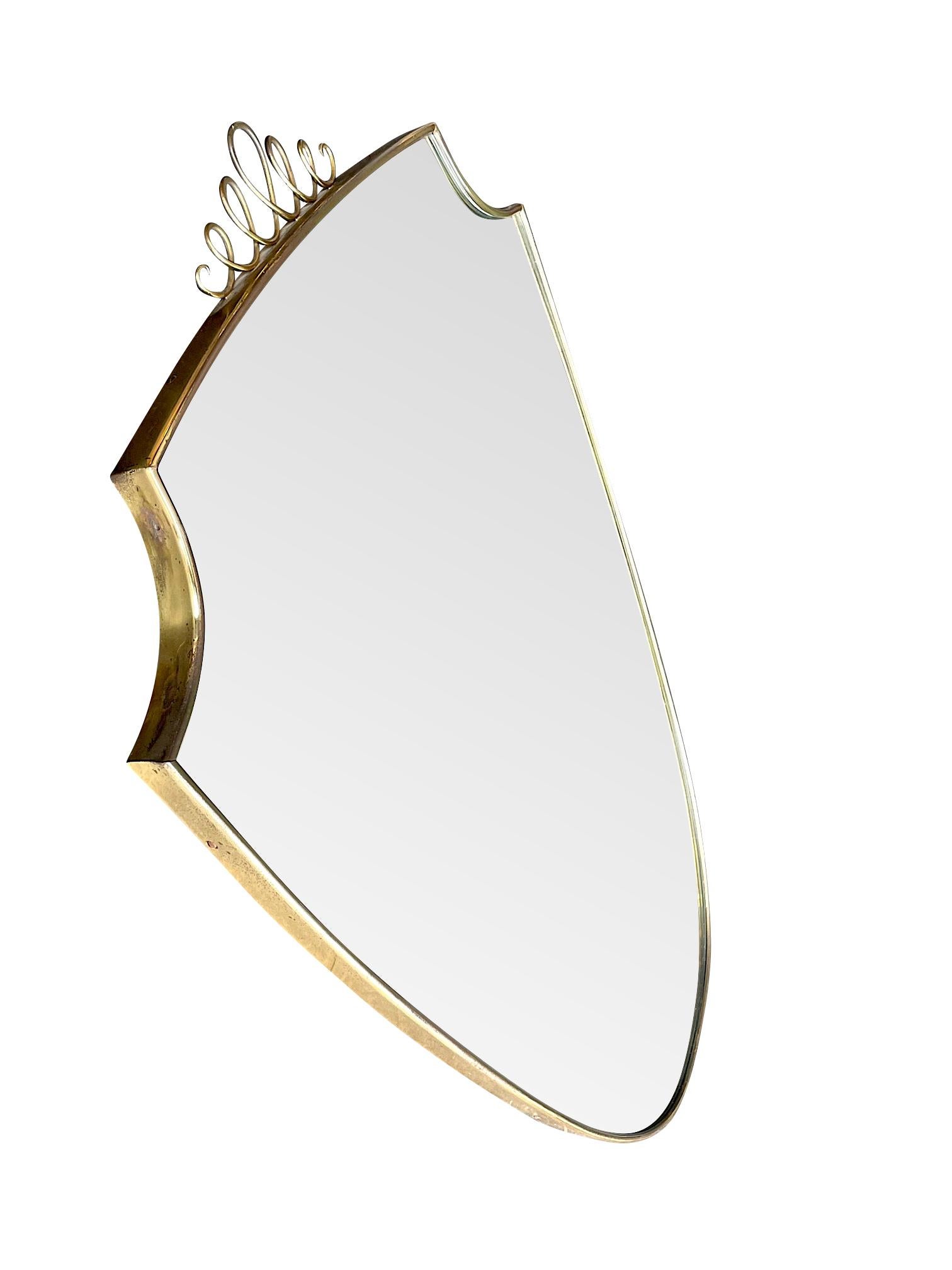 Mid-Century Modern Original 1950s Italian Brass Shield Mirror with Central Decorative Top Detail