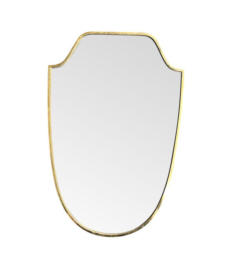 An orignal 1950s Italian shield mirror with solid wood back In Good Condition For Sale In London, GB