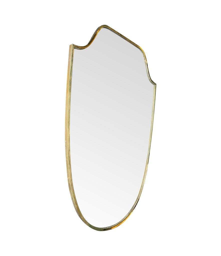 An orignal 1950s Italian shield mirror with solid wood back For Sale 2