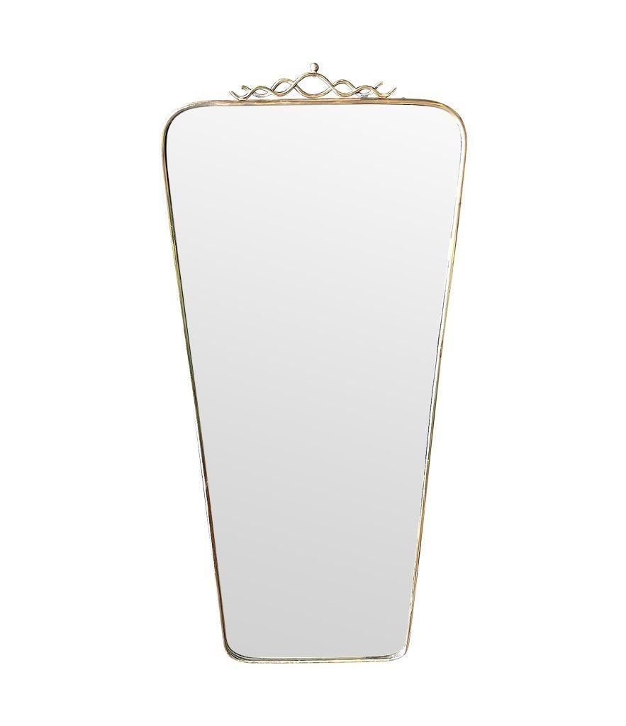 An orignal Italian 1950s brass framed mirror with scroll top detail For Sale 2