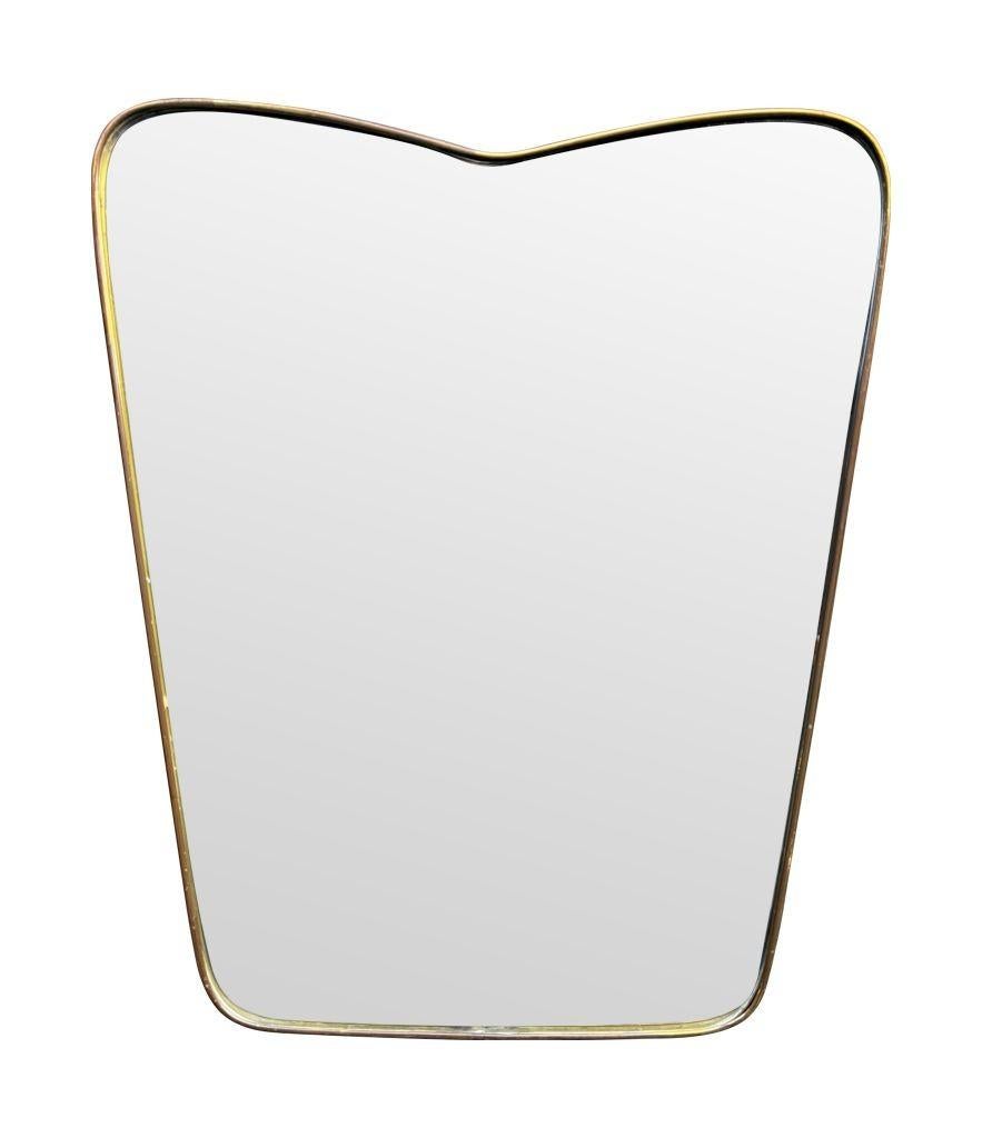 An orignal Italian 1950s brass frmed mirror with shaped top For Sale 8