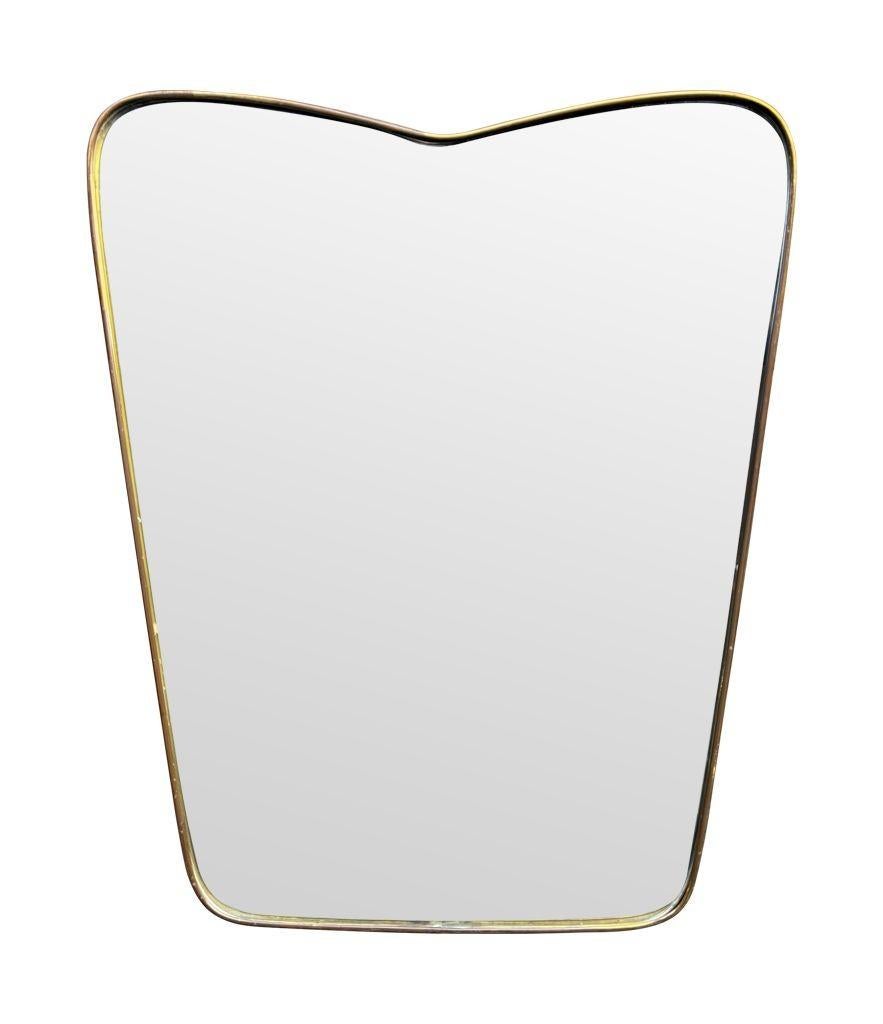 An orignal Italian 1950s brass frmed mirror with shaped top For Sale 10
