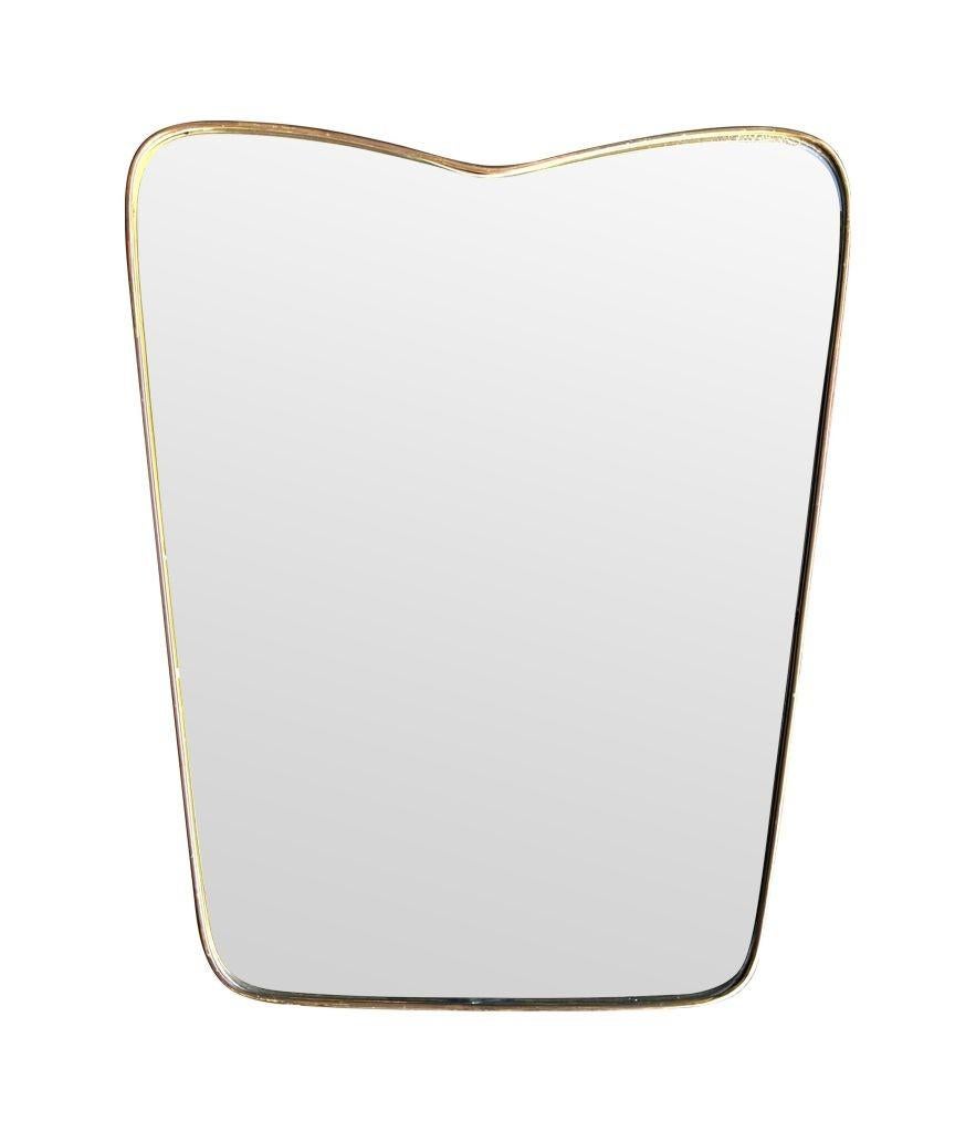 An orignal Italian 1950s brass frmed mirror with shaped top In Good Condition For Sale In London, GB
