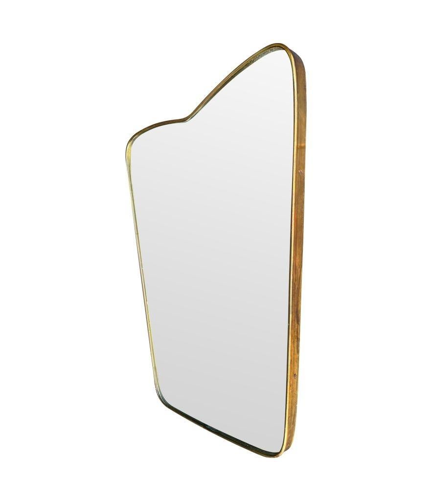 Mid-20th Century An orignal Italian 1950s brass frmed mirror with shaped top For Sale