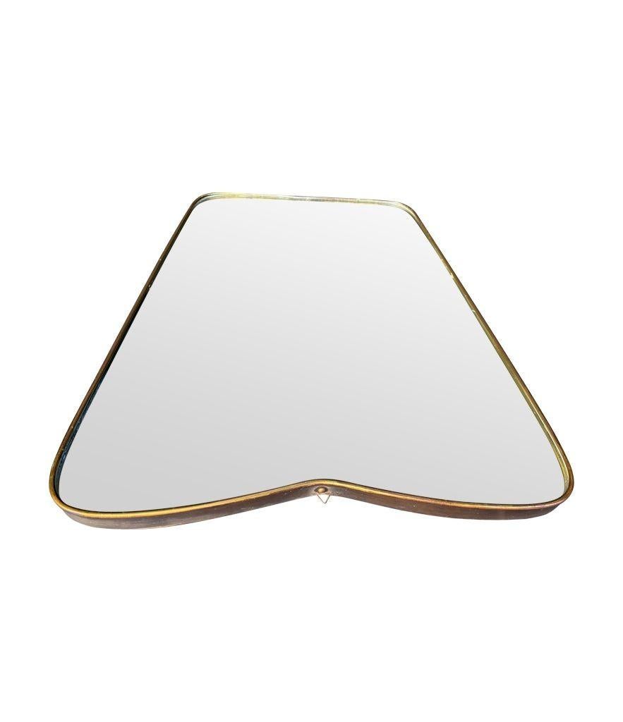 An orignal Italian 1950s brass frmed mirror with shaped top For Sale 3