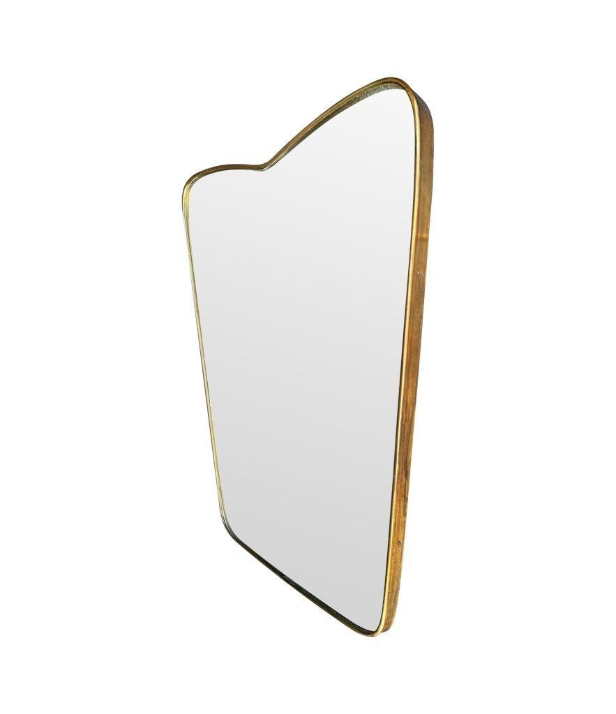 An orignal Italian 1950s brass frmed mirror with shaped top For Sale 4