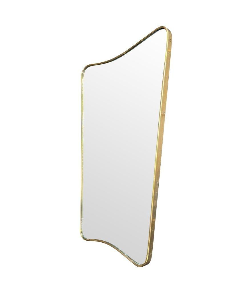 Brass An orignal Italian 1950s brass shield mirror attributed to Gio Ponti For Sale
