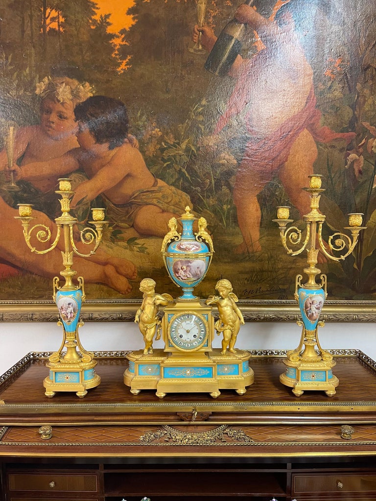 An Ormolu-Mounted Sevres Style Porcelain 'JEWELED' Turquoise-Ground Clock Set By Range Freres.

LATE 19TH CENTURY, THE CLOCK FACE INSCRIBED RAINGO FRÉRES A PARIS, THE MOVEMENT STAMPED RAING. LE ARG., PARIS,
The clock surmounted by a baluster vase