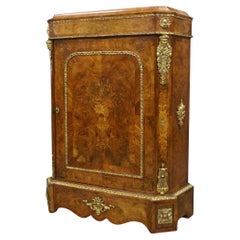 An Ormulu Mounted and Inlaid Mid 19th Century Walnut Pier Cabinet