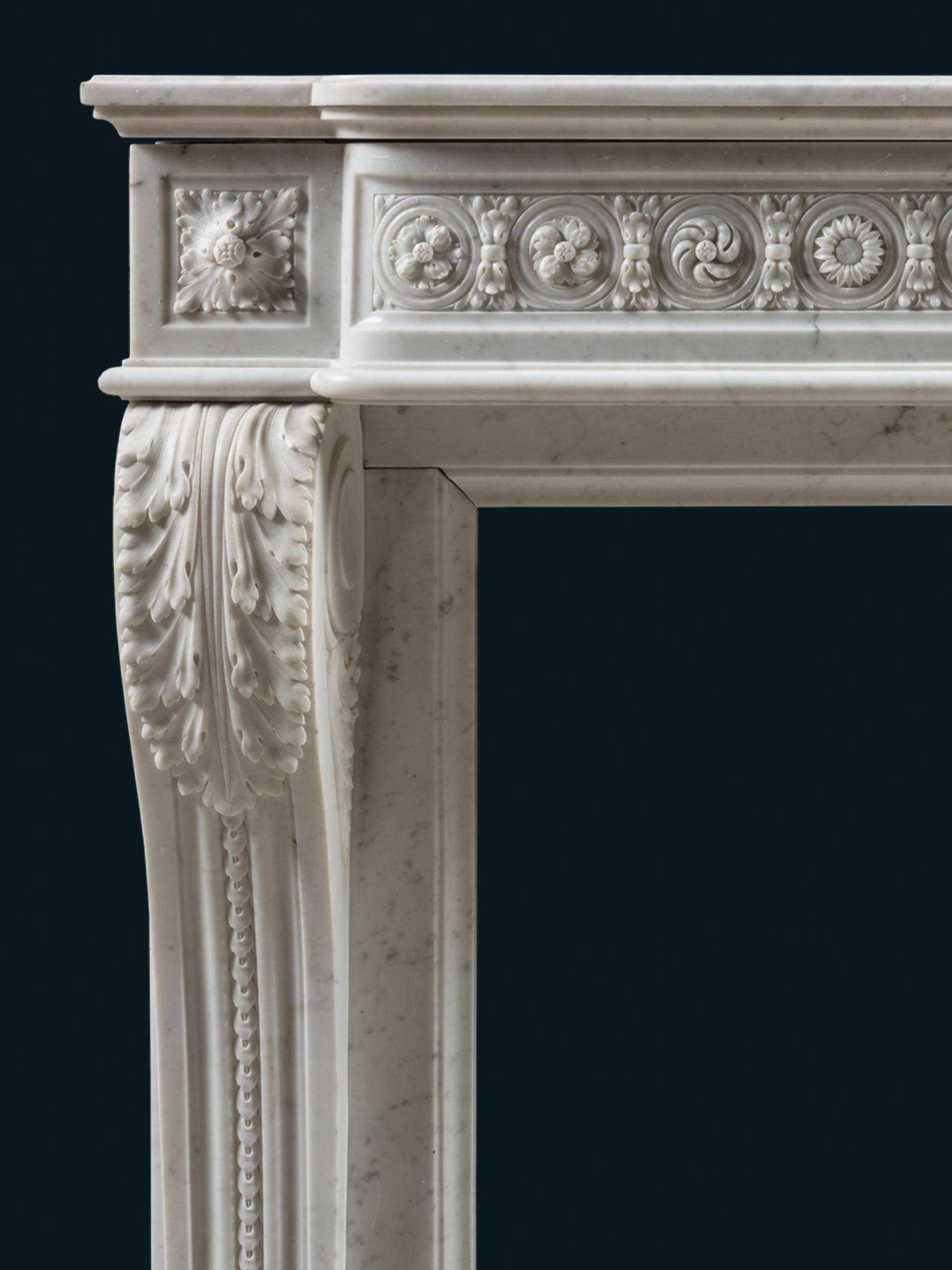 An attractive 19th century chimneypiece of substantial width and proportion, in Louis XVI style. The console jambs are splendidly carved with acanthus and with beading running down a central vale. The corner blocks are similarly carved with acanthus