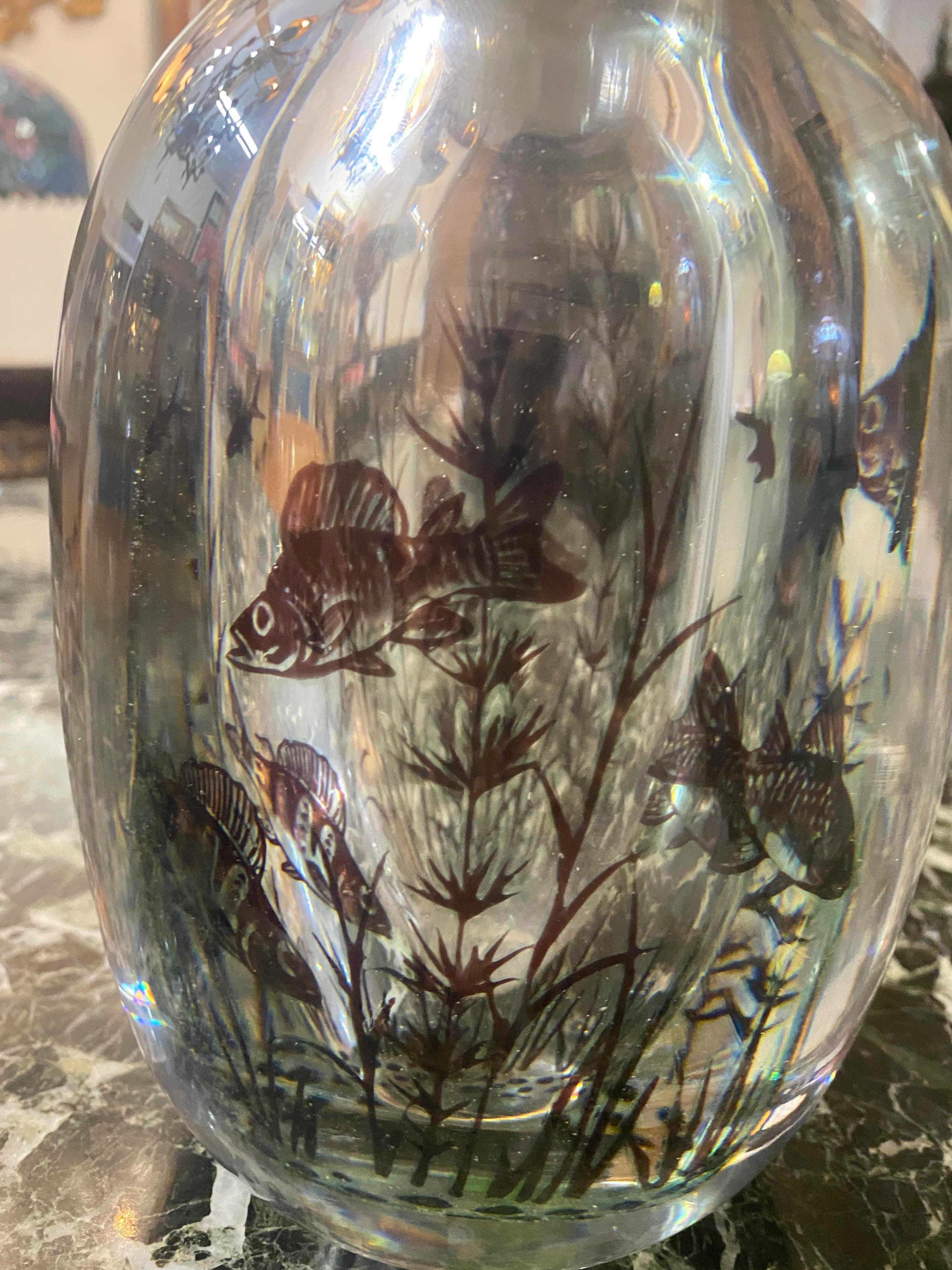 An Orrefors 'Graal' glass vase, Sweden, 20th century, internally decorated with various fish and plants
signed by the artist
and etched Orrefors, Sweden
Measures: Height 6.5 in., diameter 4.5 in.