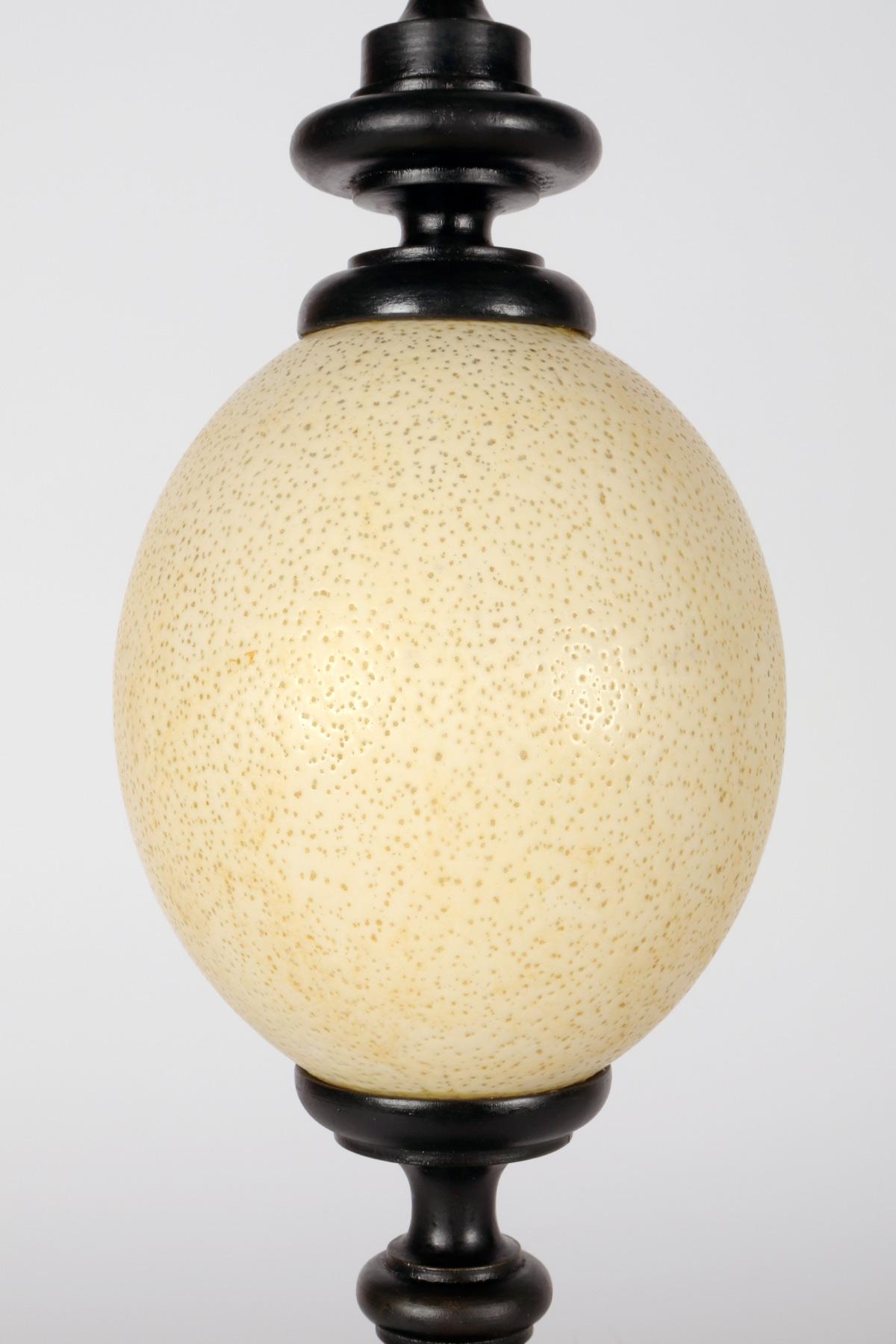 An ostrich egg from a wunderkammer, with an ebonized wooden base, Italy 1900. For Sale 2