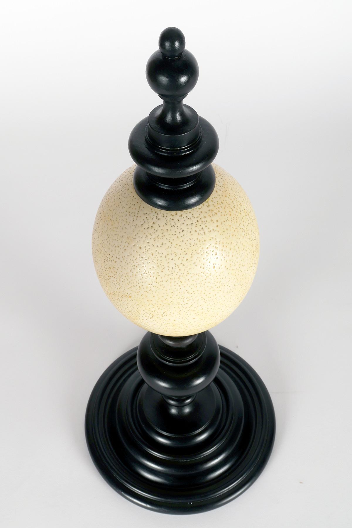 An ostrich egg from a wunderkammer, with an ebonized wooden base, Italy 1900. For Sale 3