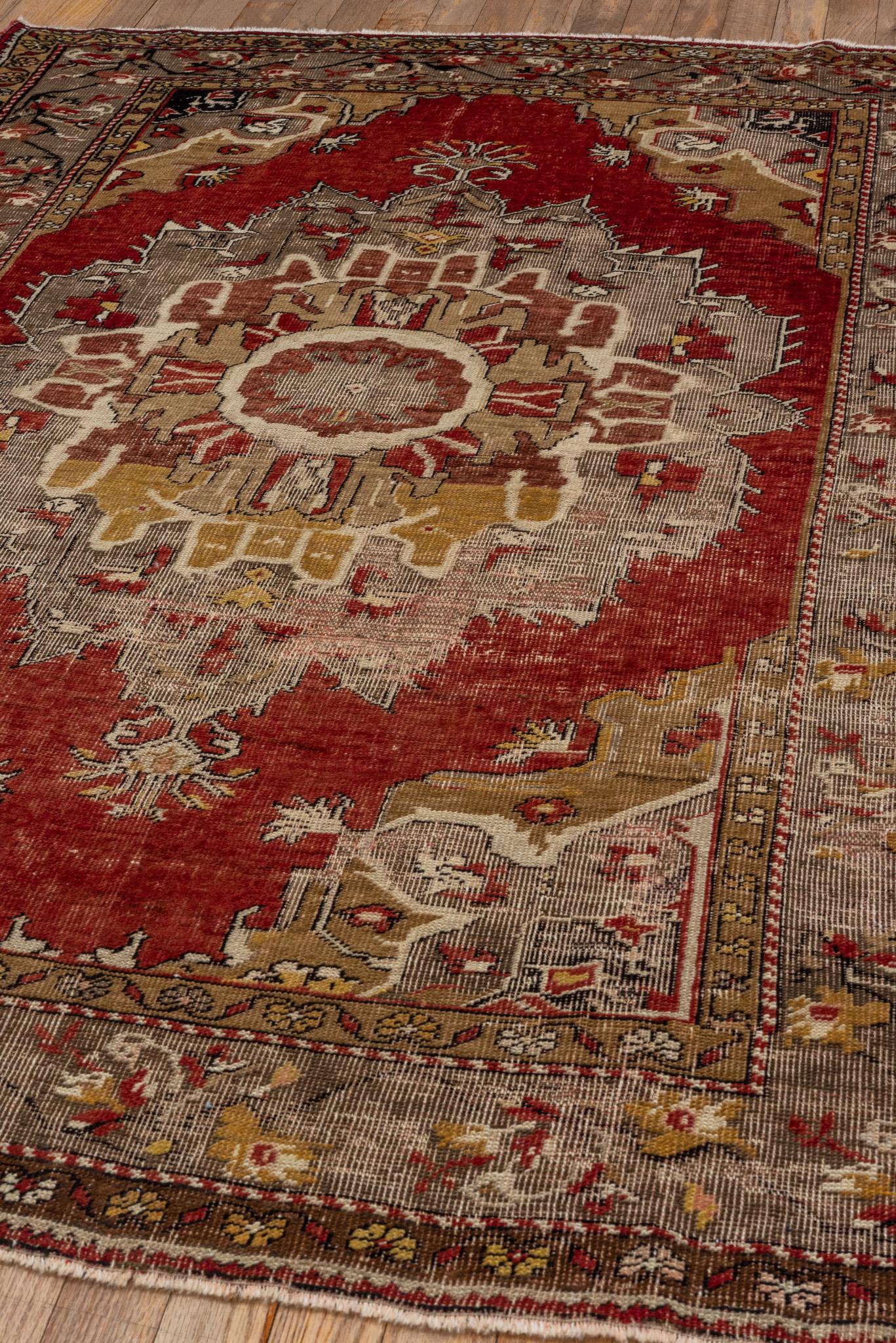 An Oushak Rug circa 1920.  Hand knotted, made of 100% wool yarn.