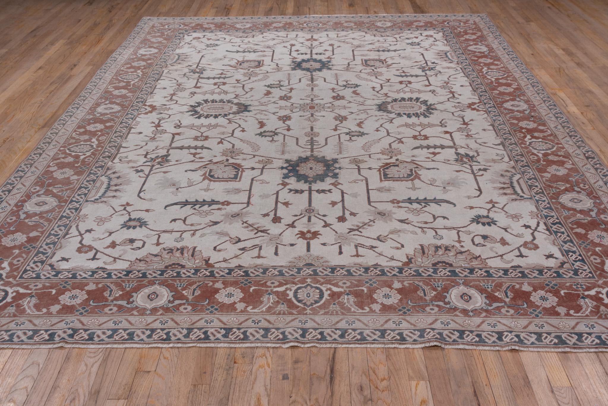 An Oushak Rug circa 1930. Hand Knotted, made of 100% wool yarn. 