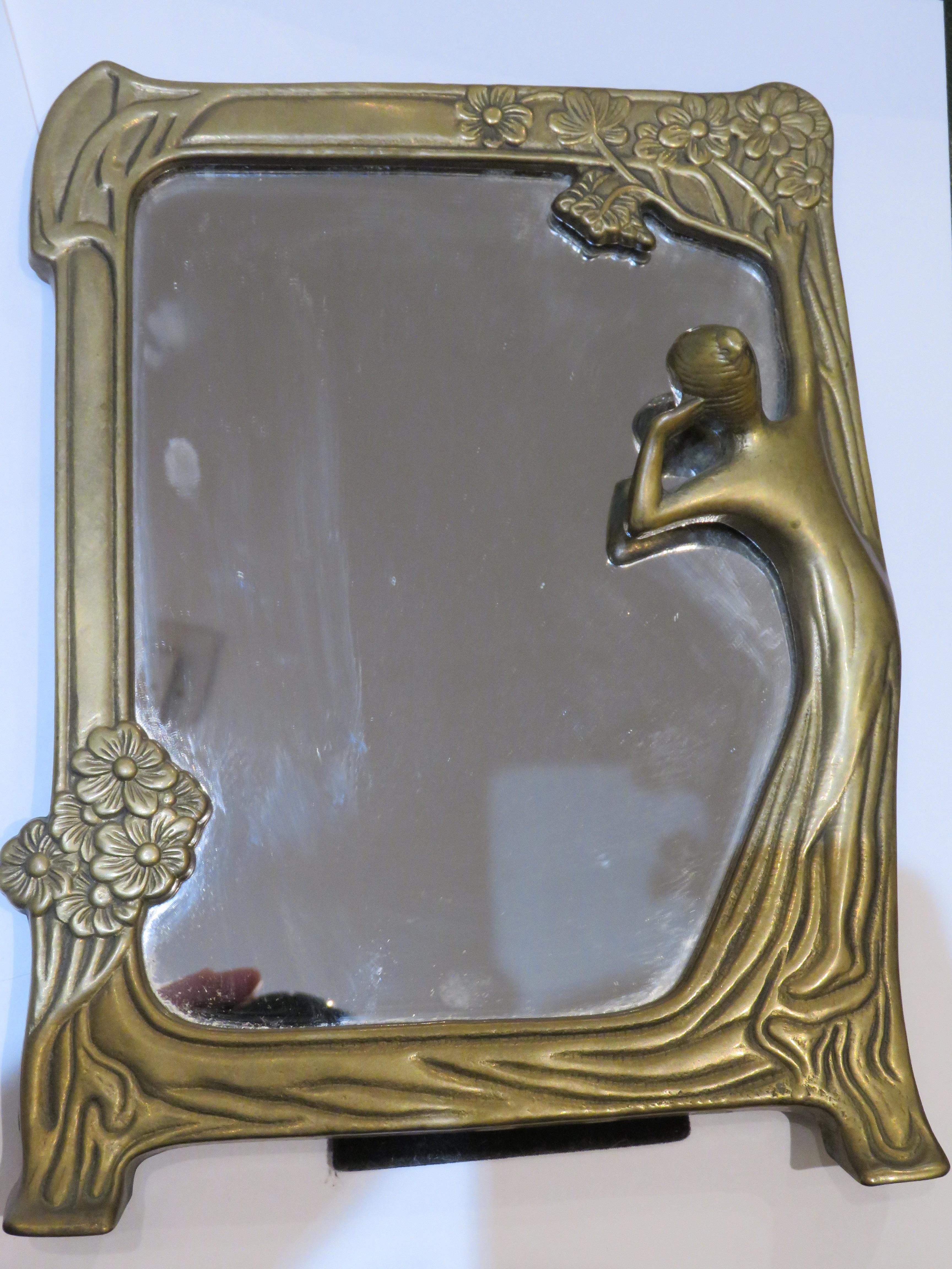 An Outstanding Art Deco Maiden Vanity Standing Flip Mirror. Finely done with Impressive Bronze Detail of a Maiden Fixing her Hair. Taken out of an Upper East Side New York City Estate. 


