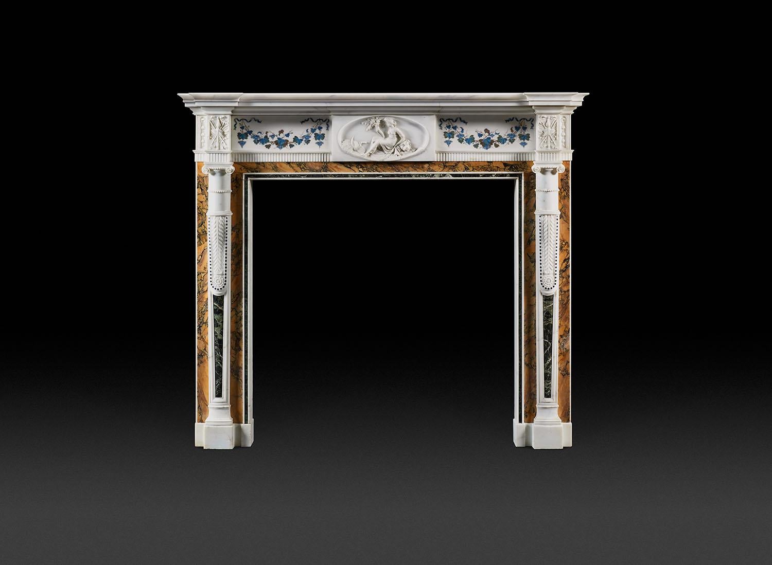 A superb late 18th century Irish Neoclassical fireplace in statuary, Siena and Verde Antico marbles with statuary panels inlaid with scagliola swags of 'Bossi' work of the highest quality. Dublin, Circa 1780–1785.

With a stepped and moulded shelf