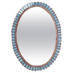 An Oval Convex Mirror in Vintage Blue Glass Frame.
