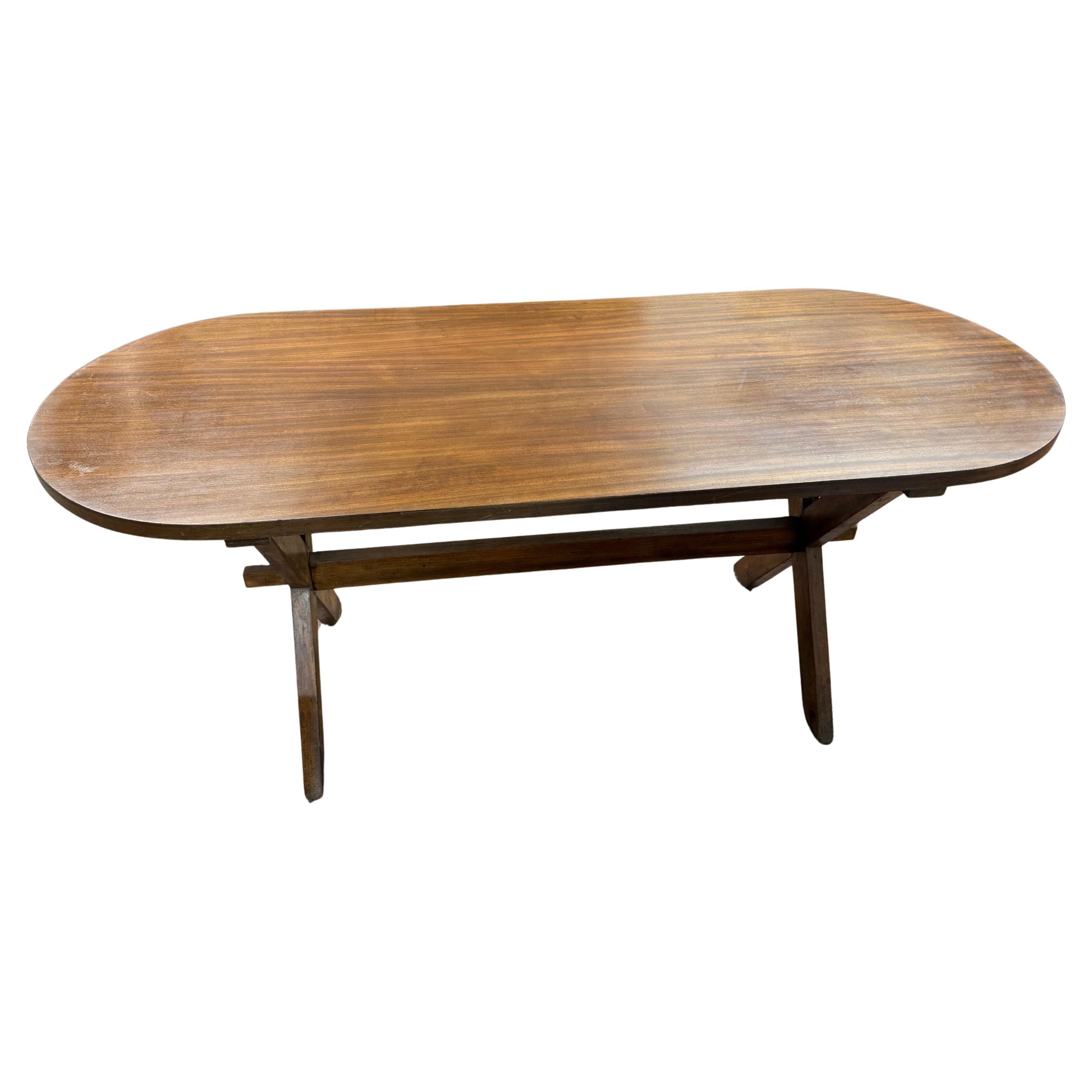An oval dining table circa 1960 For Sale
