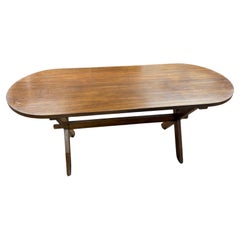 An oval dining table circa 1960