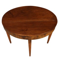 An Oval Mahogany Table with Tapered Legs