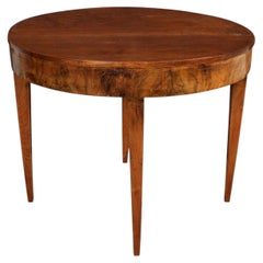 An Oval Mahogany Table with Tapered Legs